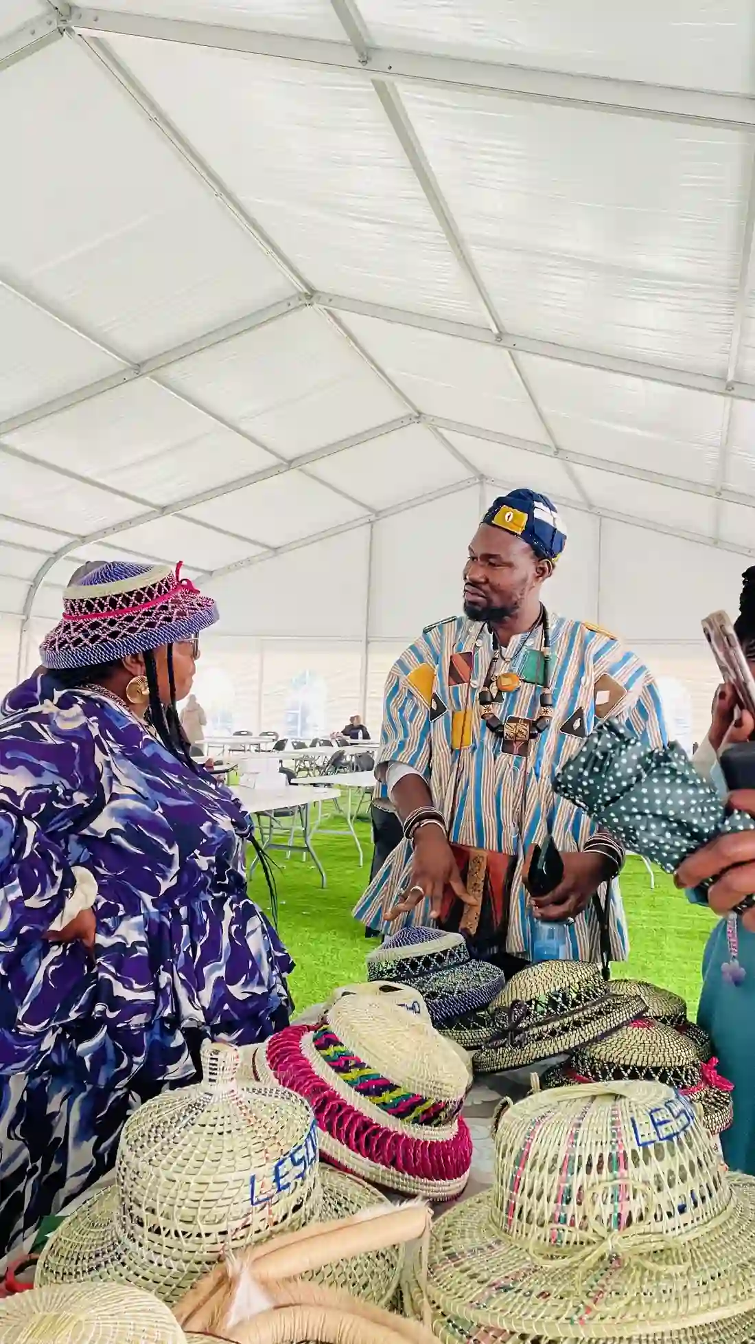 Artisans and designers with their work at the Lesotho edition
