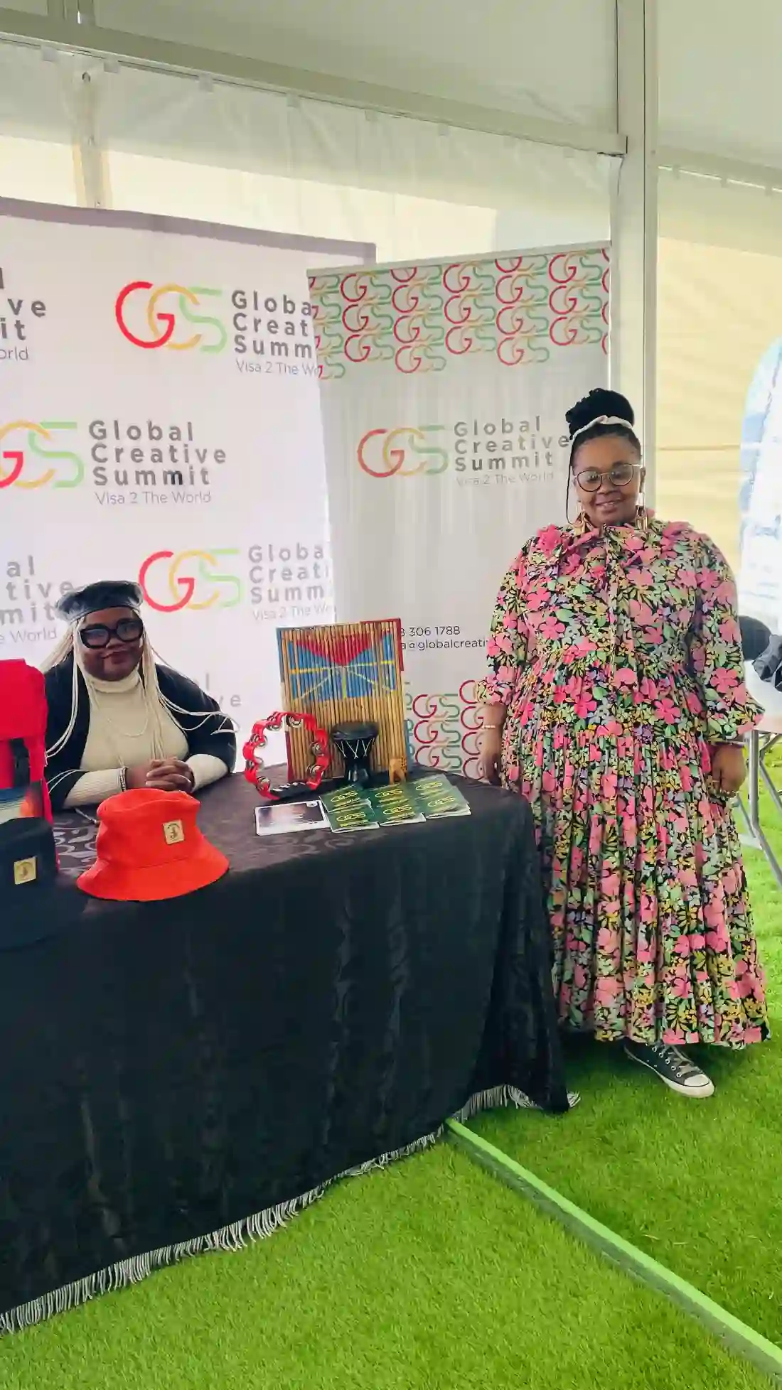 Delegates standing at the Global Creative Summit branded stand in Lesotho