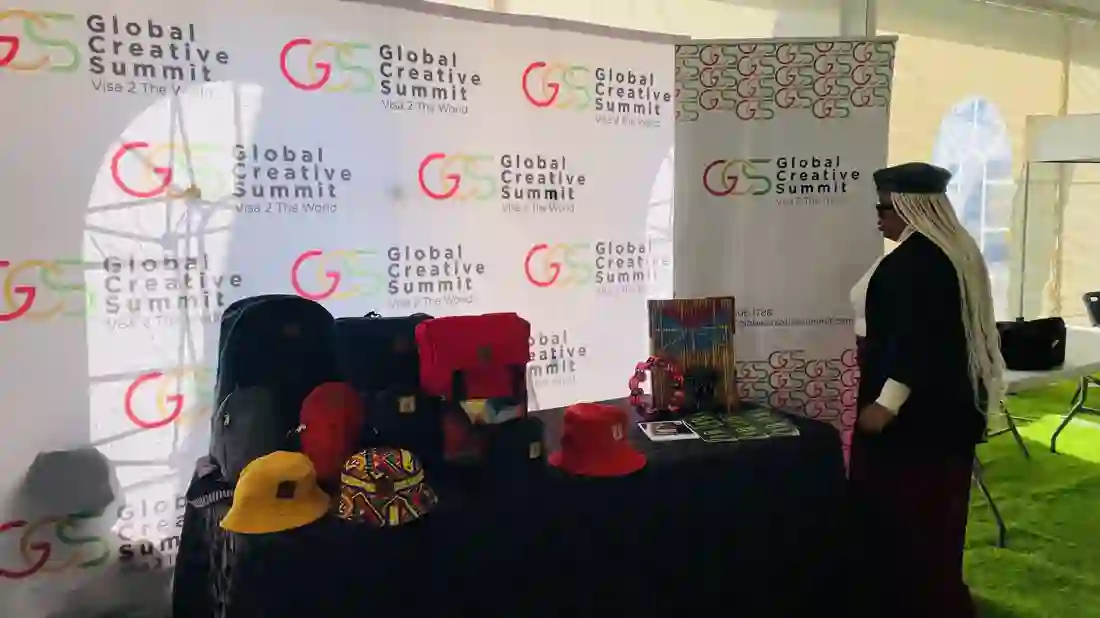 The Global Creative Summit exhibition stand in Lesotho, displaying Basotho hats and craftwork